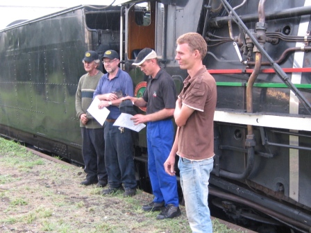 Footplate crew Cliff, John and Dewald with their new hats, and fitter Louis, who did a lot of work restoring 3117