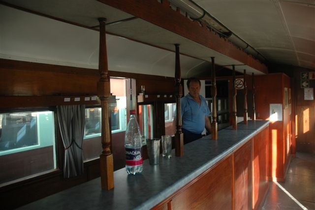 Barman Les stands proudly behind the bar counter which has been moved forward 300mm to accommodate the undercounter refrigerator