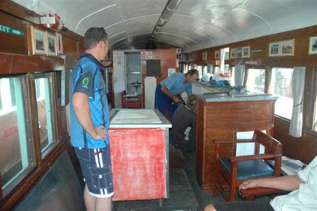 Les Weideman, the bar man, and Koos from Hercules are sorting out shelving. The original bar counter has been unscrewed and moved to make a new entrance for manoeuvring
