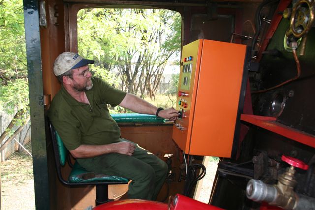 John Ashworth puts on a fire prior to departure with a Cape Town train. Hard work this loco..<br /><br />Photo by Chris Janisch 17/10/07