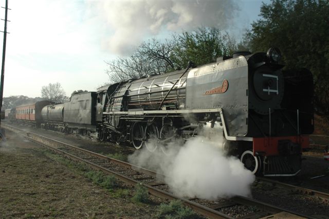 Another load out from Capital Park. 15F 3117 departs the current site with a suburban coach soon to be used as spares for a further coach conversion, to add to our set. With the ongoing relocation to Hermanstad, every opportunity is used to relocate  items. The DZ full of loco ash will be used later as back fill.