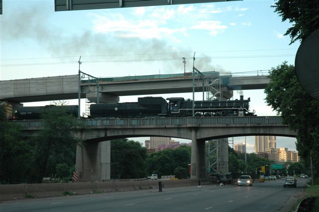 The third bridge on the approach to Pretoria city. FOTR steam charter traverses the current brdge built to replace the original steel NZASM one, whilst in the background, the new Gautrain bridge on the Hatfield link, overlooks the whole scene. One day steam and Gautrain may run side by side!