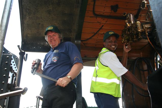 Tony Attwell looks very proud of his hard grease pump while John Madisha maintains a high visibility