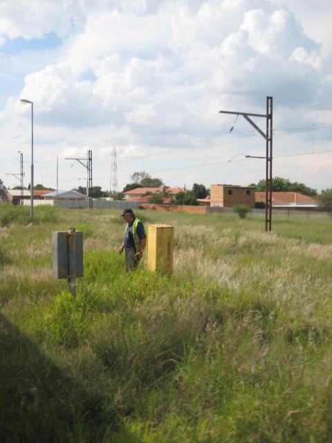 Tony has just replaced the wooden train staff in its box at Rayton<br /><br />Photo by John Ashworth 28 Nov 2009