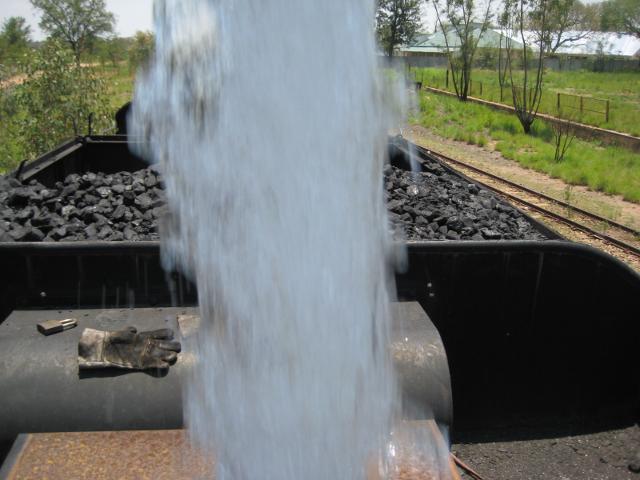 The same view, now partially obscured by the stream of water from the column