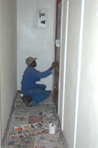 Clements is at work in the corridor of our main building, getting a bright white paint to eliminate the dour yellow it was previously painted