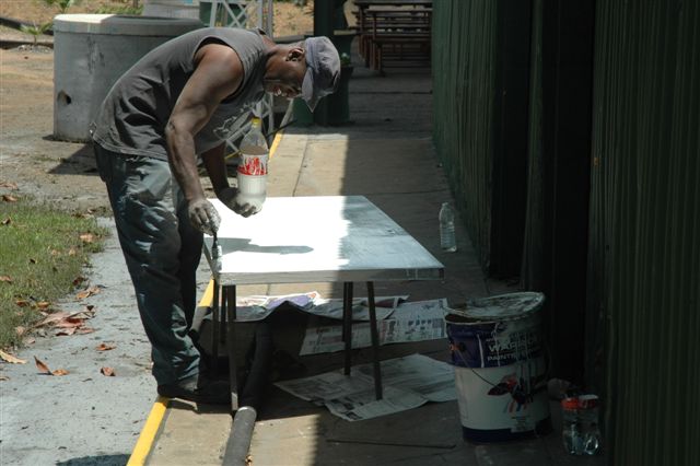 B.Z.at work painting up the new door we have installed in the main building
