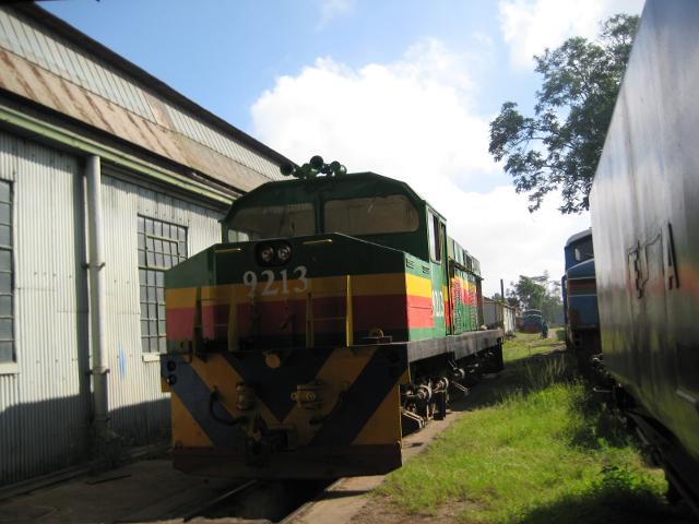 9213, under her own power, rumbles past 3020, whose tender can be seen on the right, en route through the shed to the large traverser